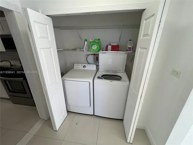 a utility room with dryer and washer