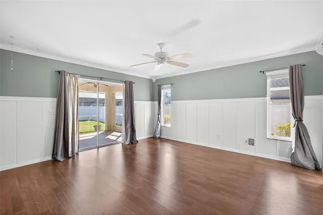 wooden floor in an empty room with a window