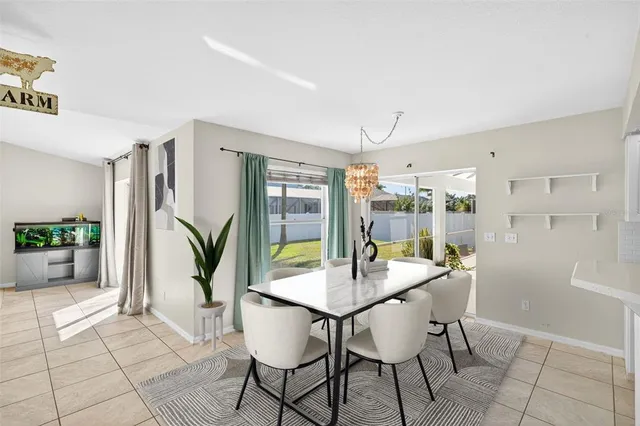 a dining room with furniture and window