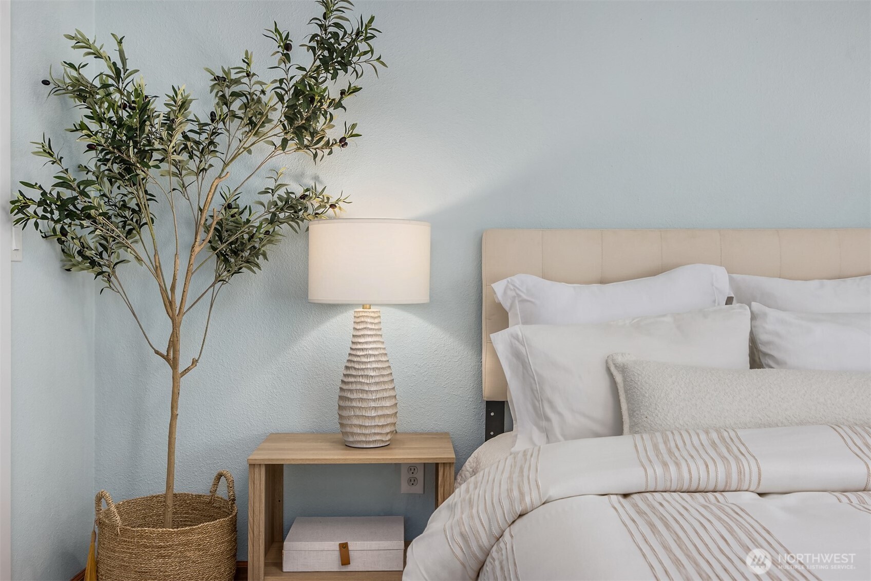 9280 Northeast Lovgreen Road Bainbridge Island, WA 98110 - Photo 16 of 40 a bed room with a bed and a potted plant