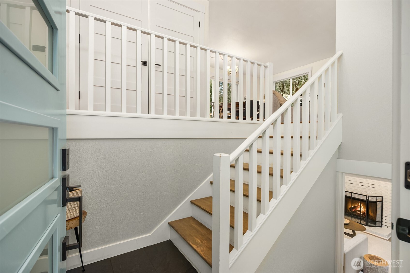 9280 Northeast Lovgreen Road Bainbridge Island, WA 98110 - Photo 2 of 40 a view of staircase with railing and white walls