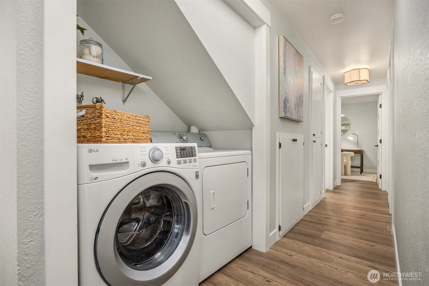 9280 Northeast Lovgreen Road Bainbridge Island, WA 98110 - Photo 23 of 40 a view of a hallway with washer and dryer