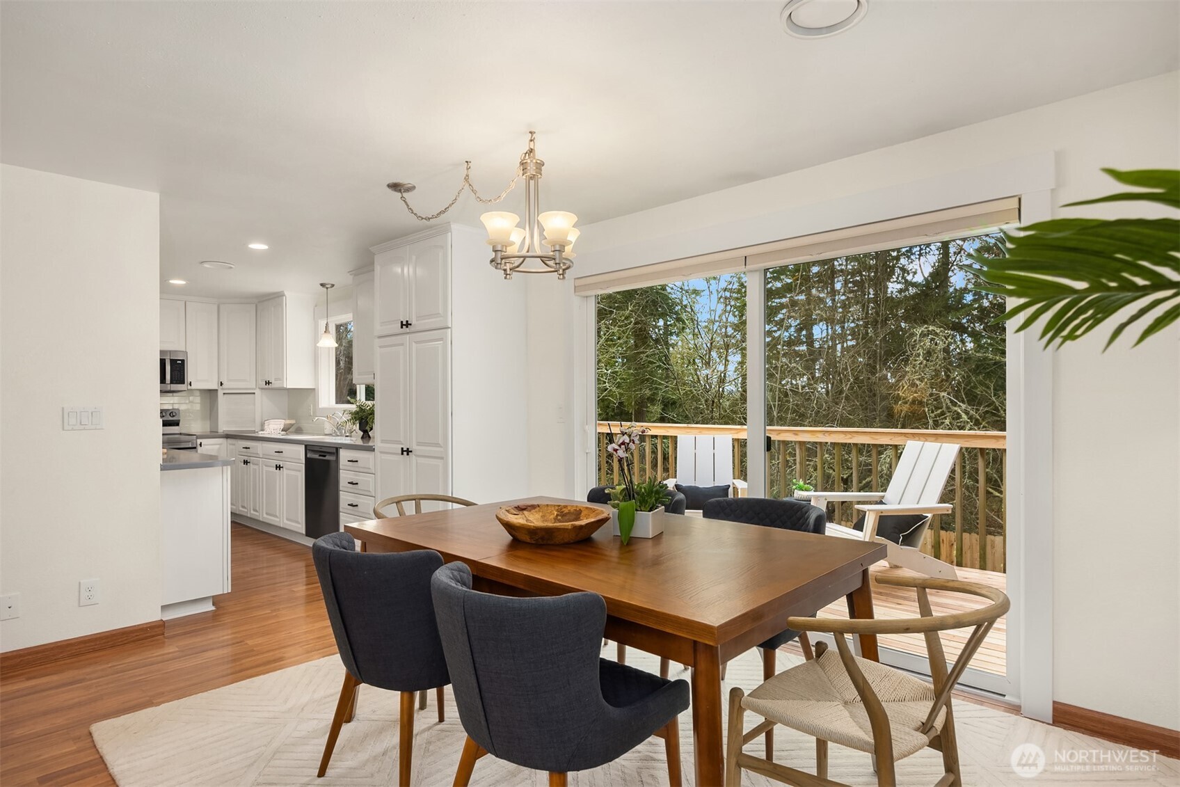 9280 Northeast Lovgreen Road Bainbridge Island, WA 98110 - Photo 6 of 40 a view of a dining room with furniture window and wooden floor