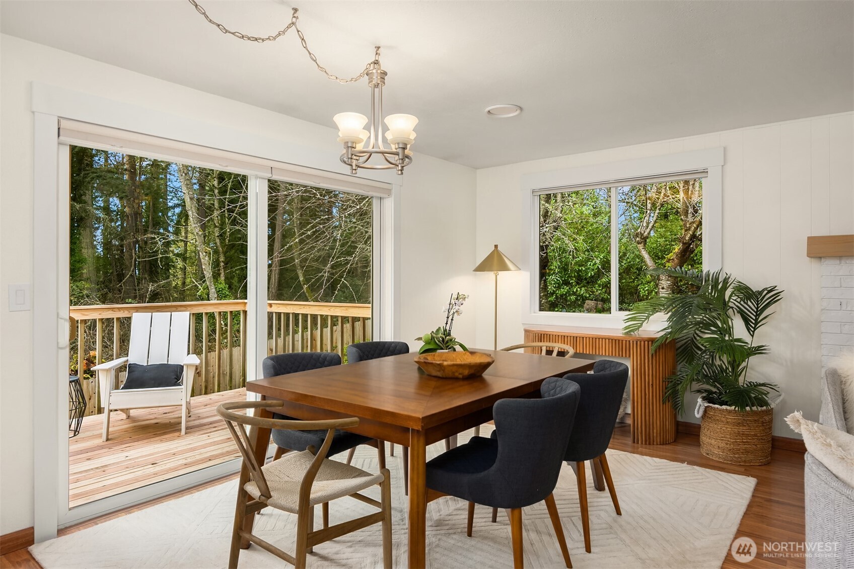9280 Northeast Lovgreen Road Bainbridge Island, WA 98110 - Photo 7 of 40 a view of a dining room with furniture window and wooden floor