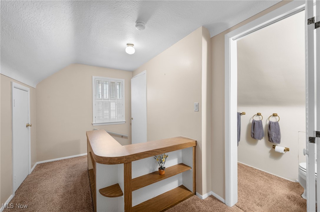 29950 Elgin Road Wickliffe, OH 44092 - Photo 22 of 40 Second-floor hallway with storage, shelves, and looking into half bath!
