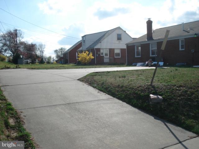 1833 Hanford Road Rosedale, MD 21237 - Photo 25 of 26 a front view of a house with a yard