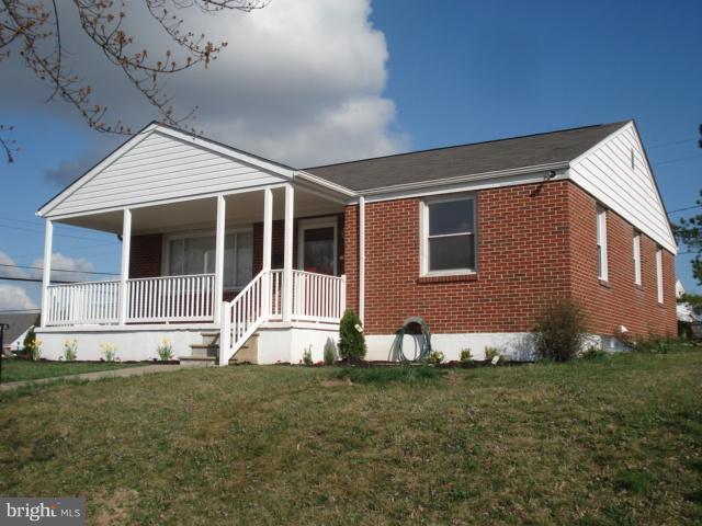 1833 Hanford Road Rosedale, MD 21237 - Photo 26 of 26 a house with lots of trees in the background