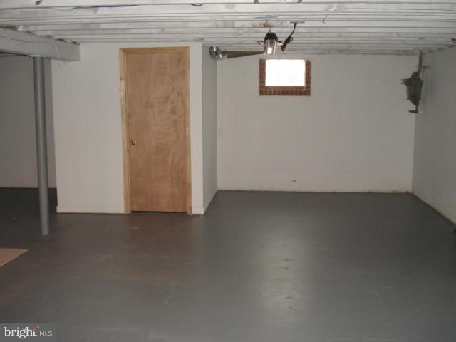 1833 Hanford Road Rosedale, MD 21237 - Photo 7 of 26 an empty room with a door