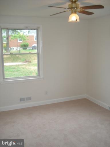 1833 Hanford Road Rosedale, MD 21237 - Photo 8 of 26 an empty room with a window