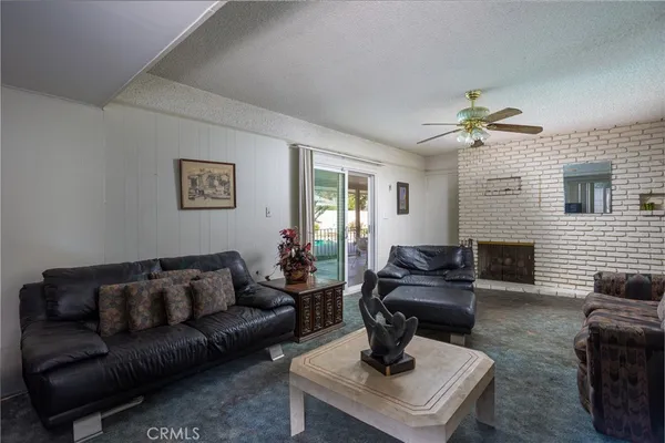 a living room with furniture a fireplace
