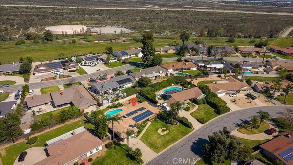 an aerial view of a houses with outdoor space