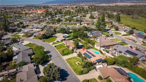 an aerial view of residential houses with outdoor space