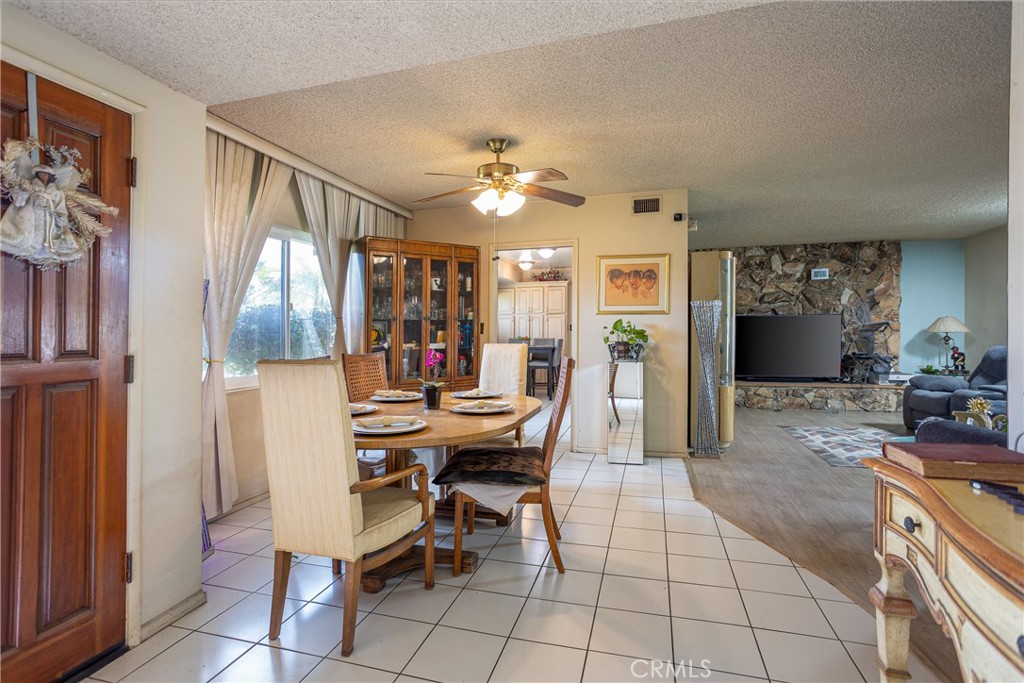 5669 Magnolia Avenue Rialto, CA 92377 - Photo 7 of 35 a view of a dining room with furniture and a chandelier