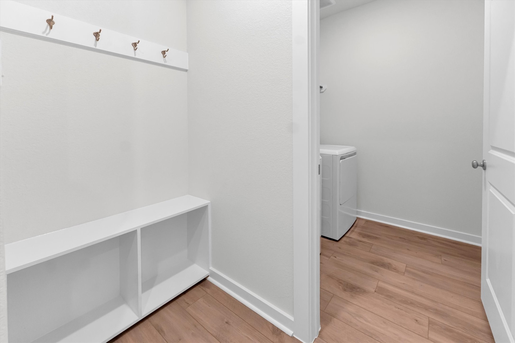 16931 Tulip Row Lane Cypress, TX 77429 - Photo 46 of 48 Mud room with extra shoe and backpack storage leads into the laundry room.