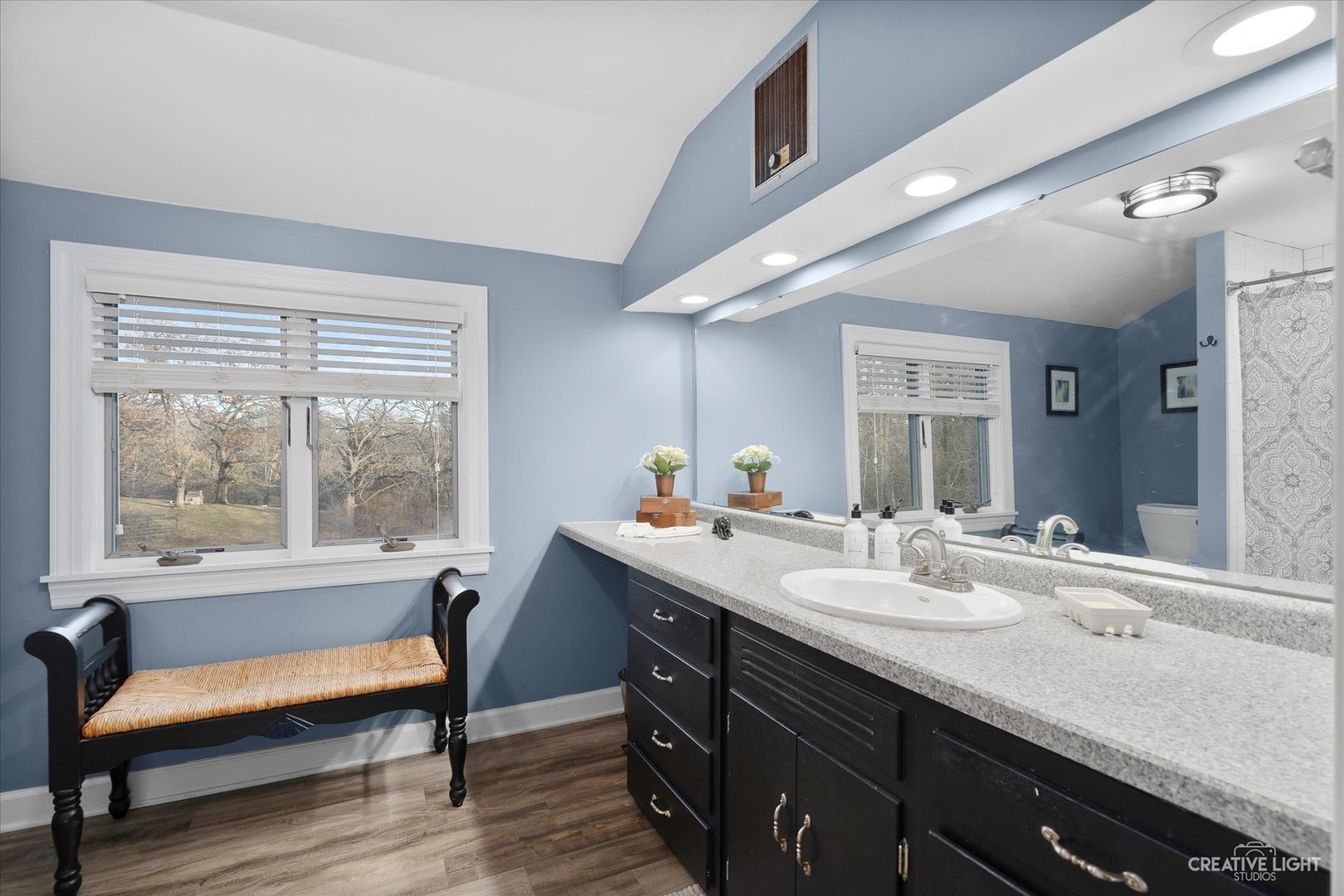 991 Hillcrest Road Elgin, IL 60123 - Photo 18 of 35 a en suite bathroom with a granite countertop sink and a large mirror