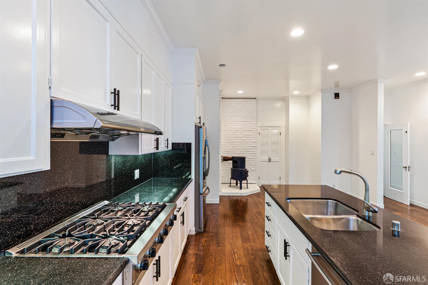 2521 Broadway San Francisco, CA 94115 - Photo 16 of 74 a kitchen with stainless steel appliances a stove a sink and a refrigerator