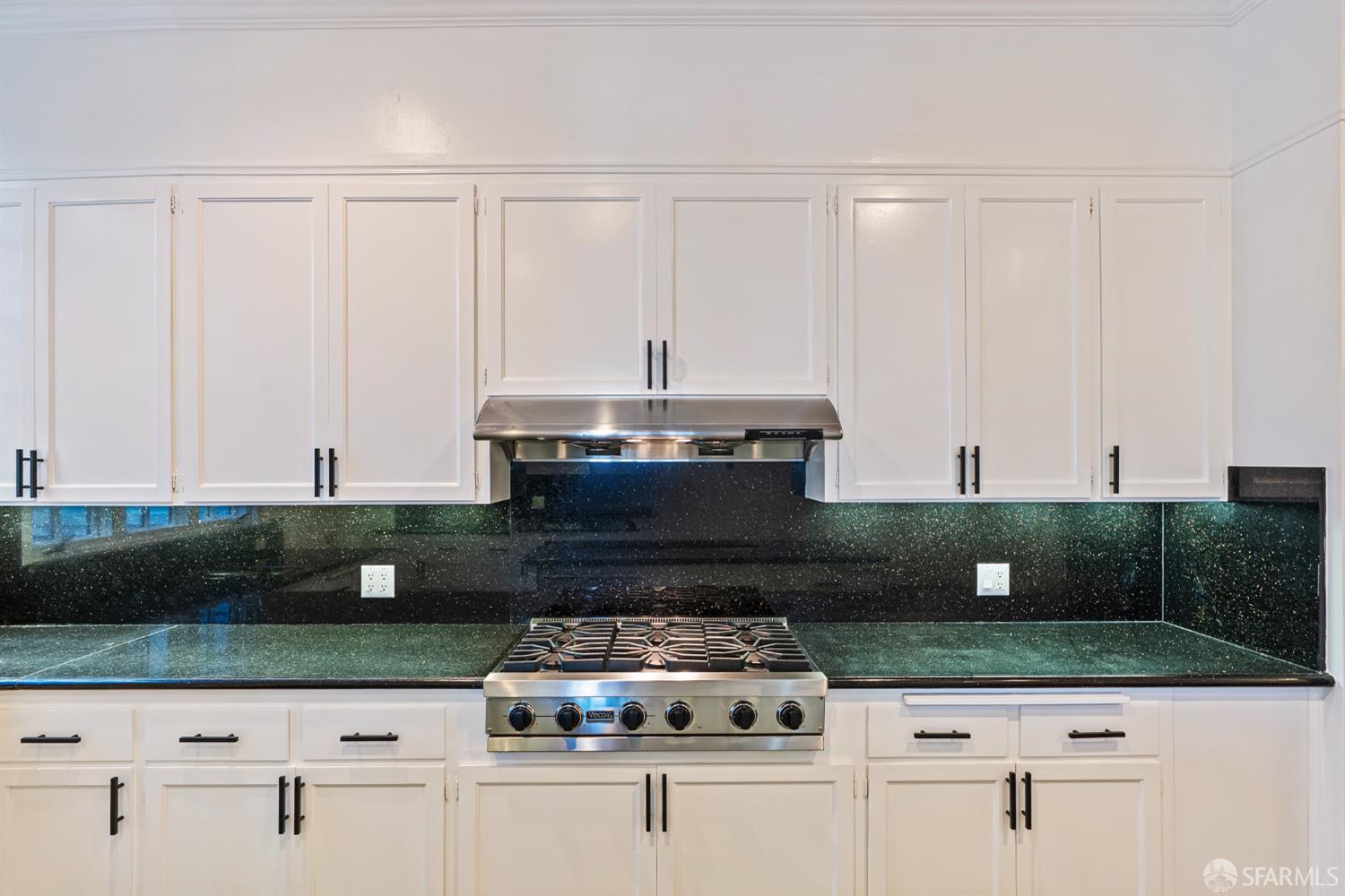 2521 Broadway San Francisco, CA 94115 - Photo 17 of 74 a kitchen with stainless steel appliances kitchen island granite countertop a stove a sink and a microwave