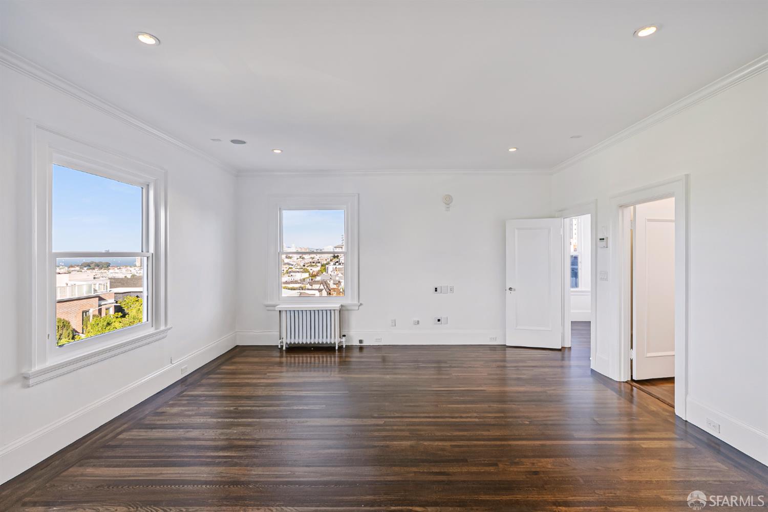 2521 Broadway San Francisco, CA 94115 - Photo 22 of 74 a view of an empty room with window and wooden floor