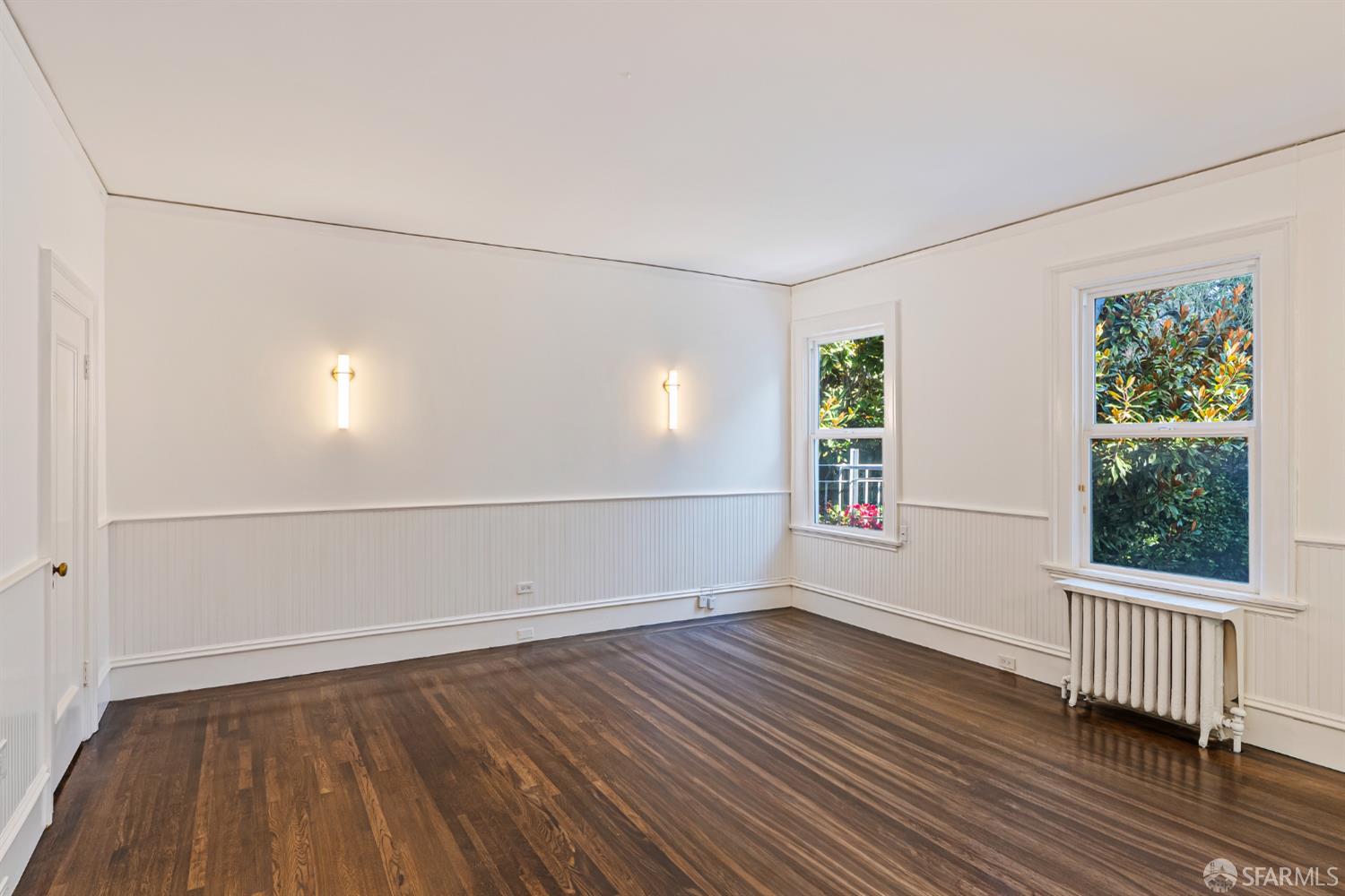 2521 Broadway San Francisco, CA 94115 - Photo 28 of 74 an empty room with wooden floor and windows