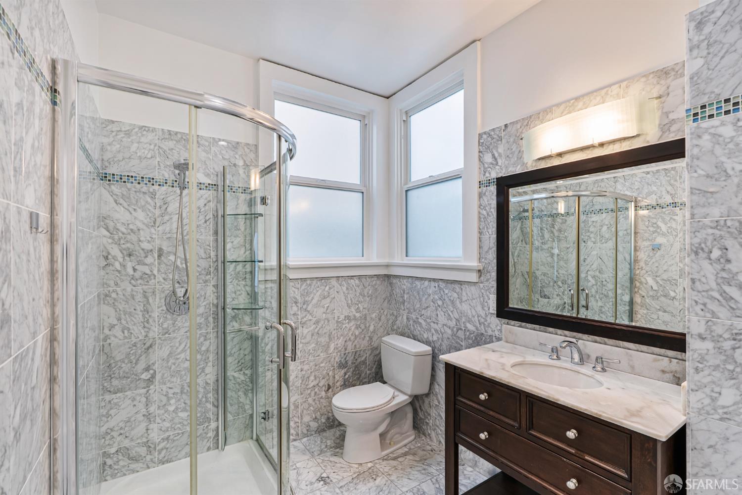 2521 Broadway San Francisco, CA 94115 - Photo 35 of 74 a bathroom with a sink toilet and shower