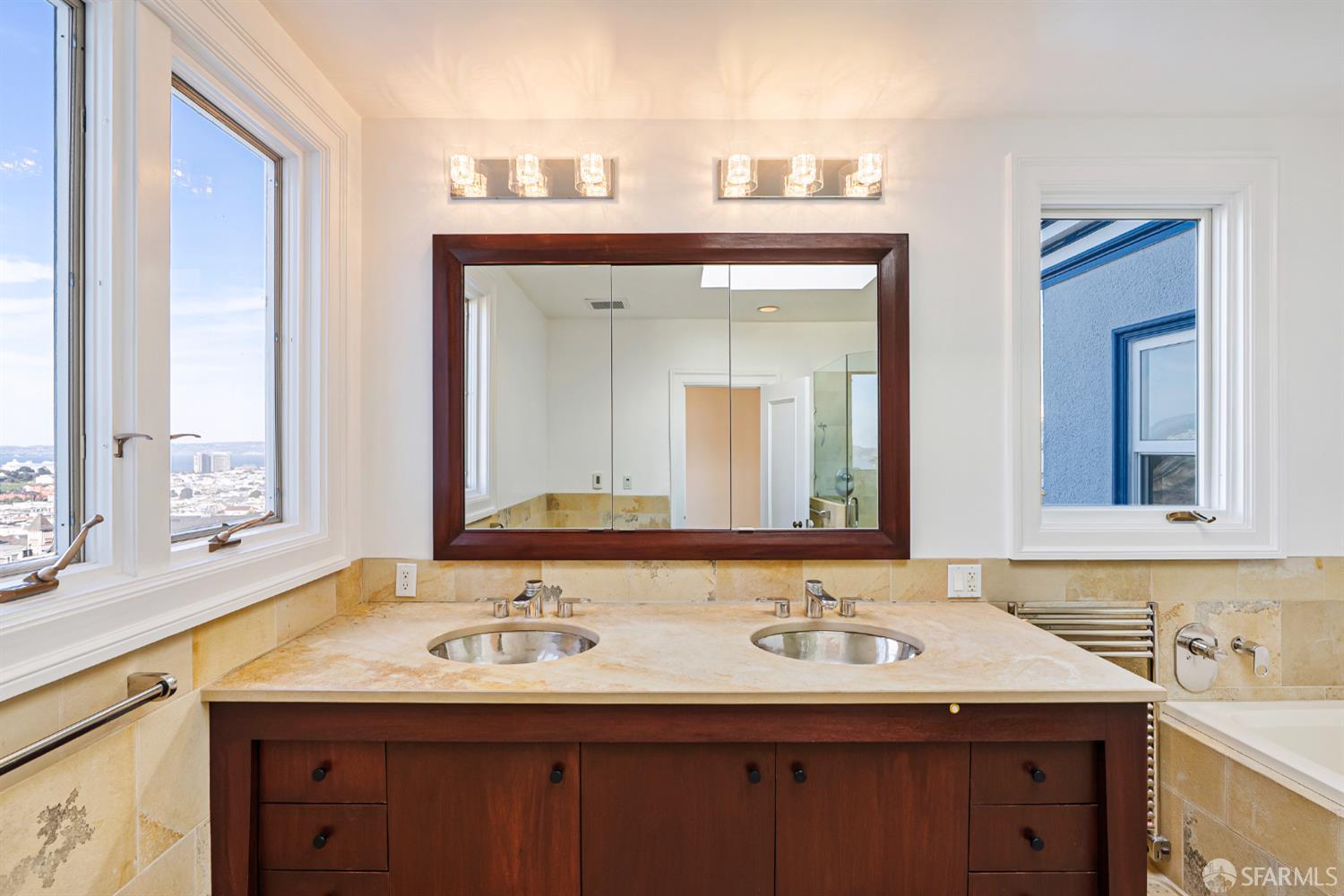 2521 Broadway San Francisco, CA 94115 - Photo 40 of 74 a bathroom with a granite countertop sink and a mirror