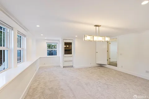 a view of a kitchen with stainless steel appliances