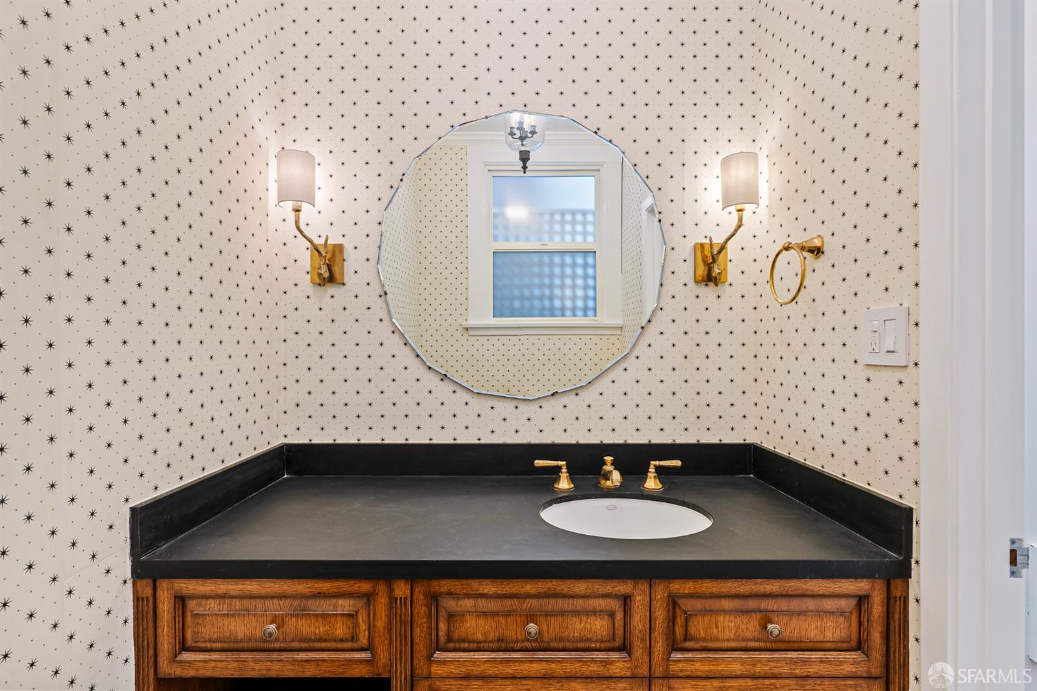2521 Broadway San Francisco, CA 94115 - Photo 55 of 74 a bathroom with a sink and a mirror
