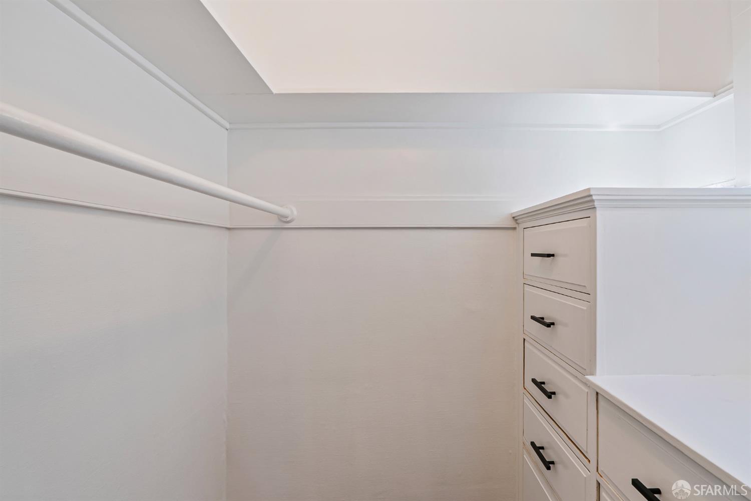 2521 Broadway San Francisco, CA 94115 - Photo 66 of 74 a view of walk in closet with empty racks