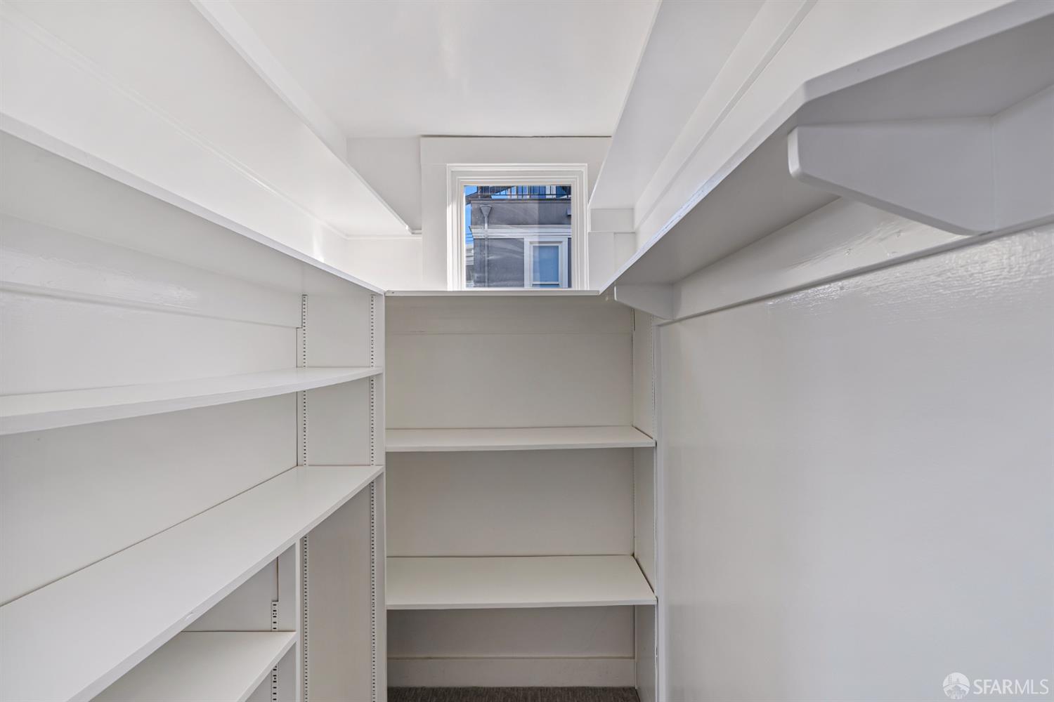 2521 Broadway San Francisco, CA 94115 - Photo 67 of 74 a view of walk in closet with empty racks