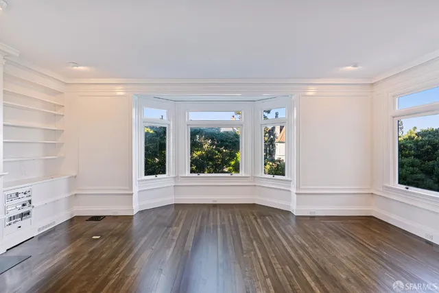 a kitchen with stainless steel appliances granite countertop a stove and a refrigerator