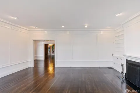 a kitchen with stainless steel appliances a stove a sink a microwave and cabinets