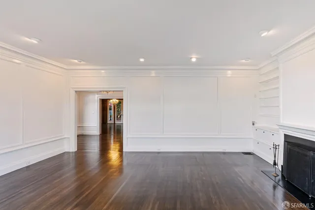 a kitchen with stainless steel appliances a stove a sink a microwave and cabinets