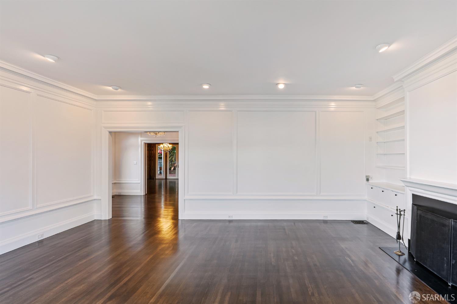 2521 Broadway San Francisco, CA 94115 - Photo 10 of 74 a view of empty room with wooden floor and fireplace