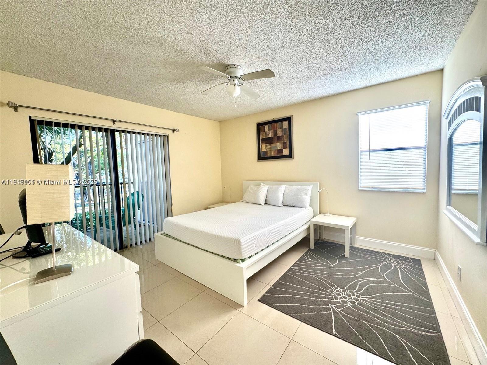 620 South Park Road, Unit 272 Hollywood, FL 33021 - Photo 14 of 23 a bedroom with a bed and a large window