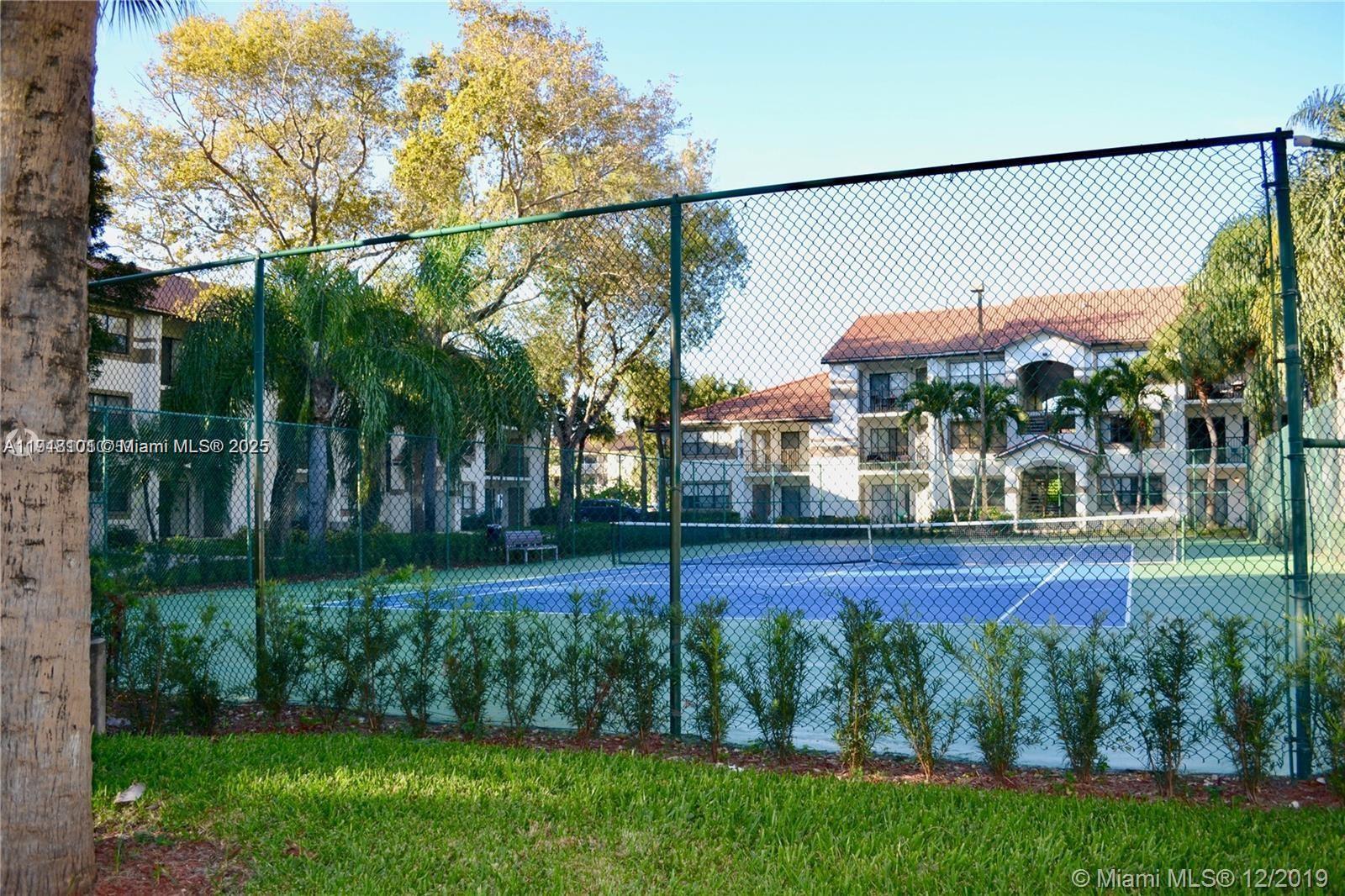 620 South Park Road, Unit 272 Hollywood, FL 33021 - Photo 18 of 23 a view of a yard and front view of a house
