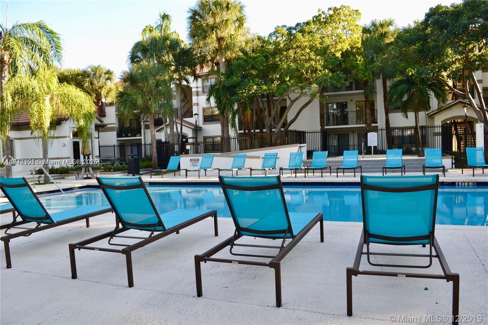620 South Park Road, Unit 272 Hollywood, FL 33021 - Photo 20 of 23 a view of a chairs and table in backyard