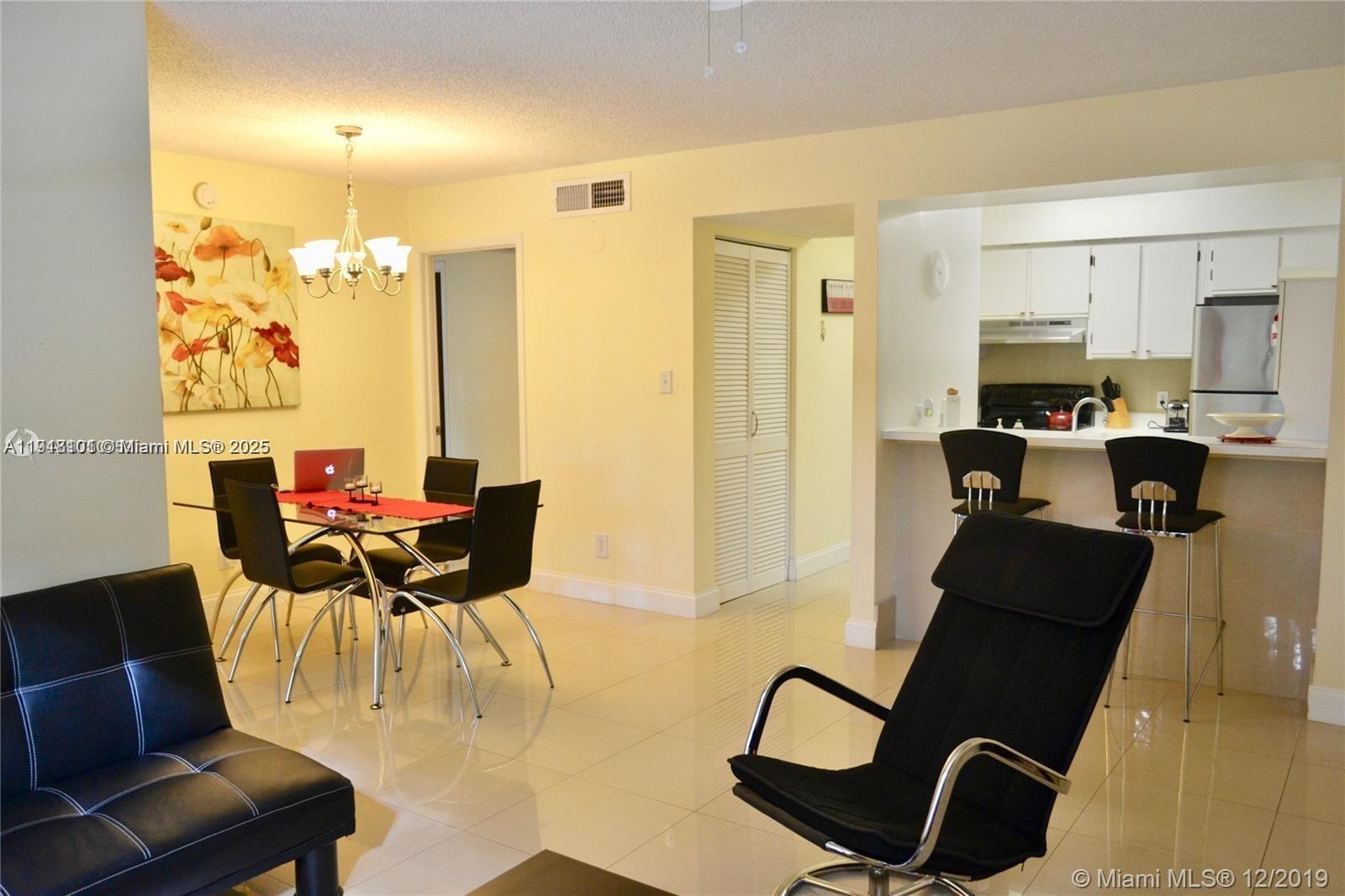 620 South Park Road, Unit 272 Hollywood, FL 33021 - Photo 7 of 23 a view of a dining room with furniture