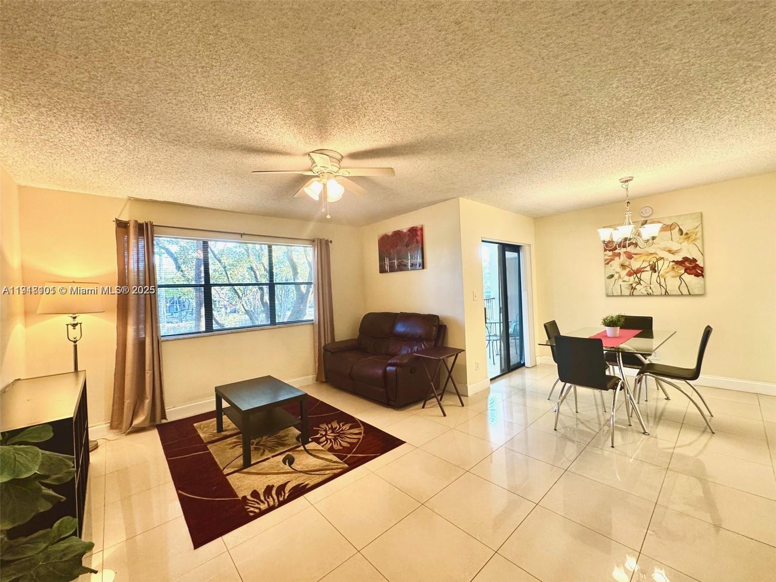 620 South Park Road, Unit 272 Hollywood, FL 33021 - Photo 8 of 23 a living room with furniture and a window