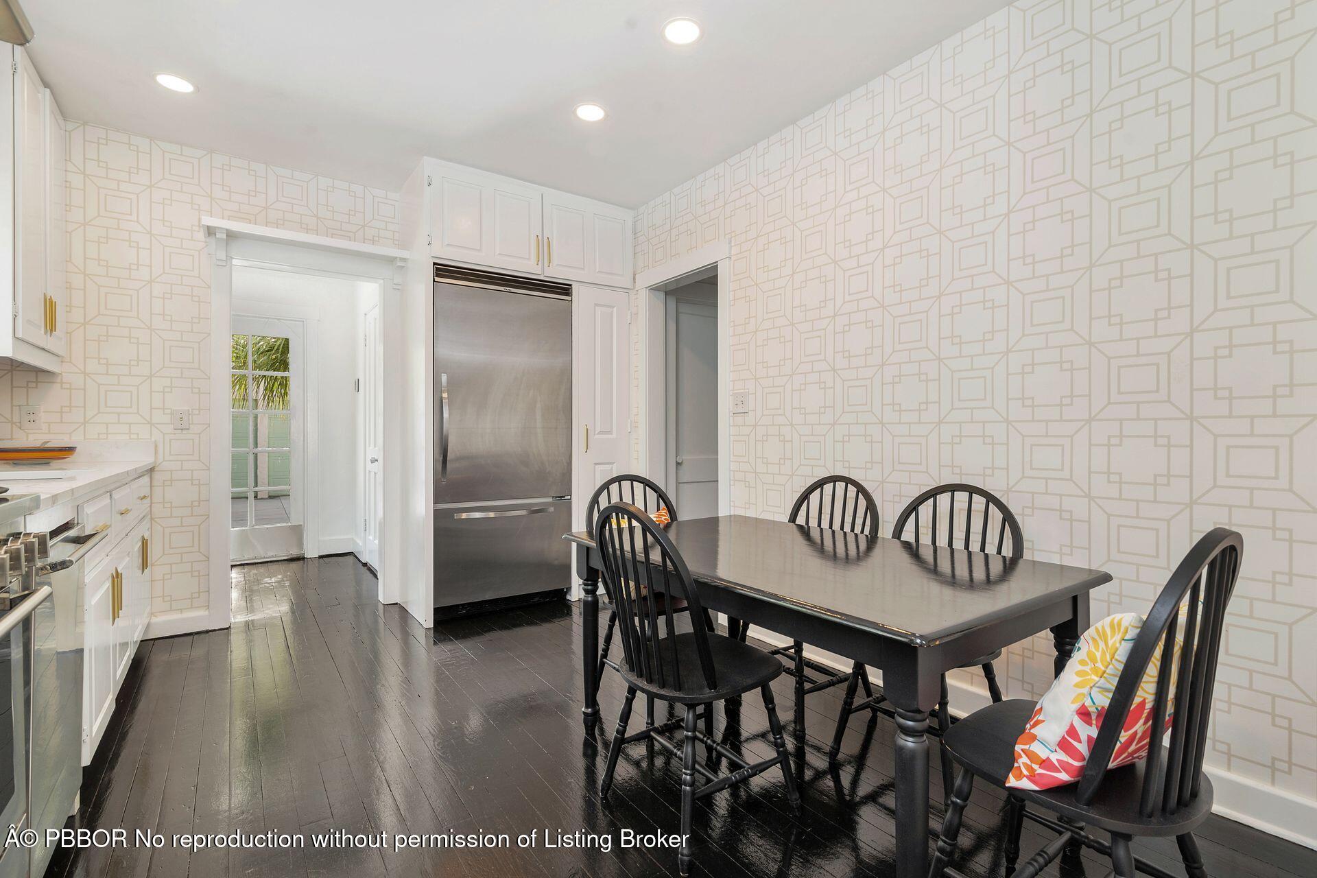 3020 Vincent Road West Palm Beach, FL 33405 - Photo 11 of 56 a view of a a dining room with furniture window and wooden floor