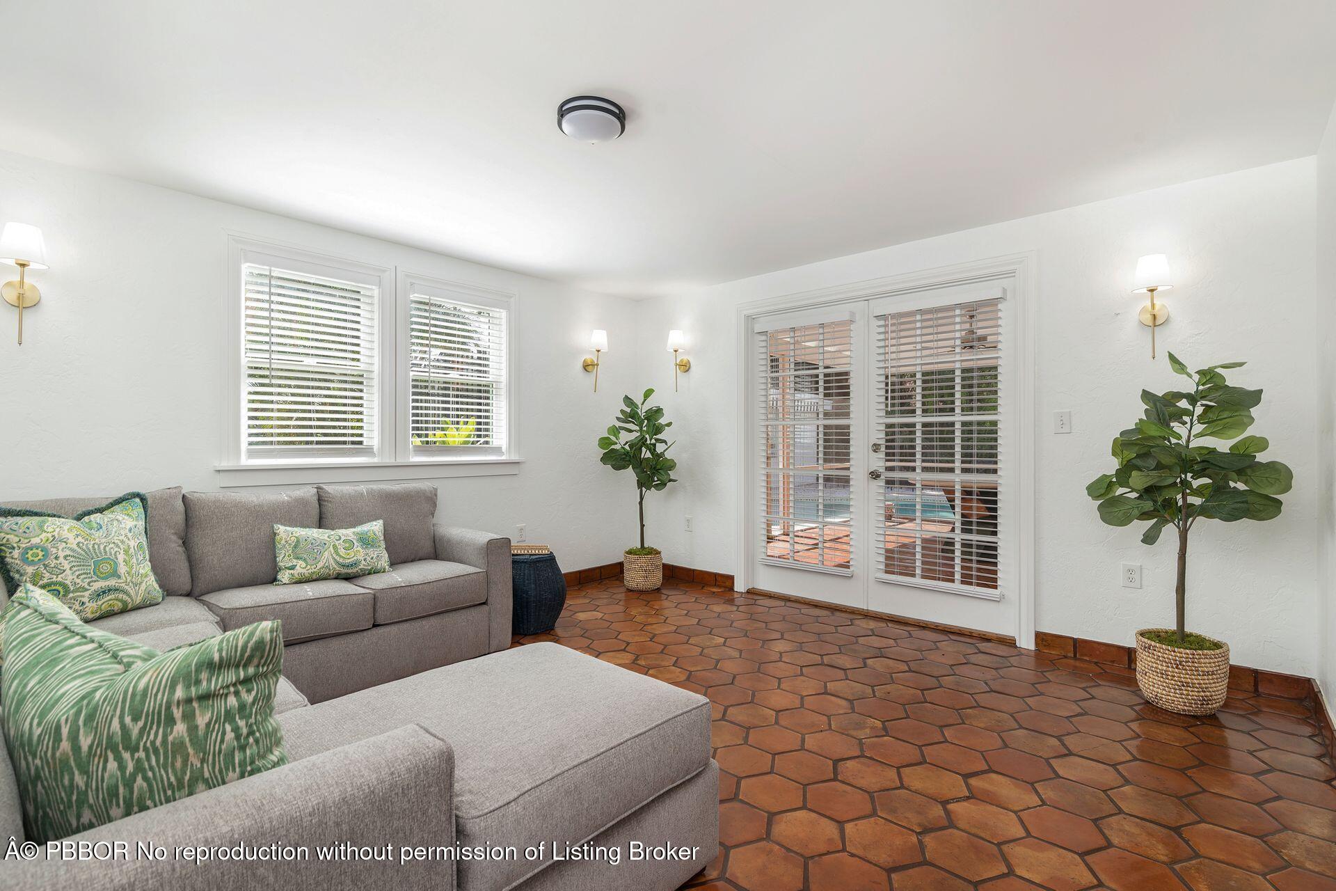 3020 Vincent Road West Palm Beach, FL 33405 - Photo 12 of 56 a living room with furniture and a potted plant