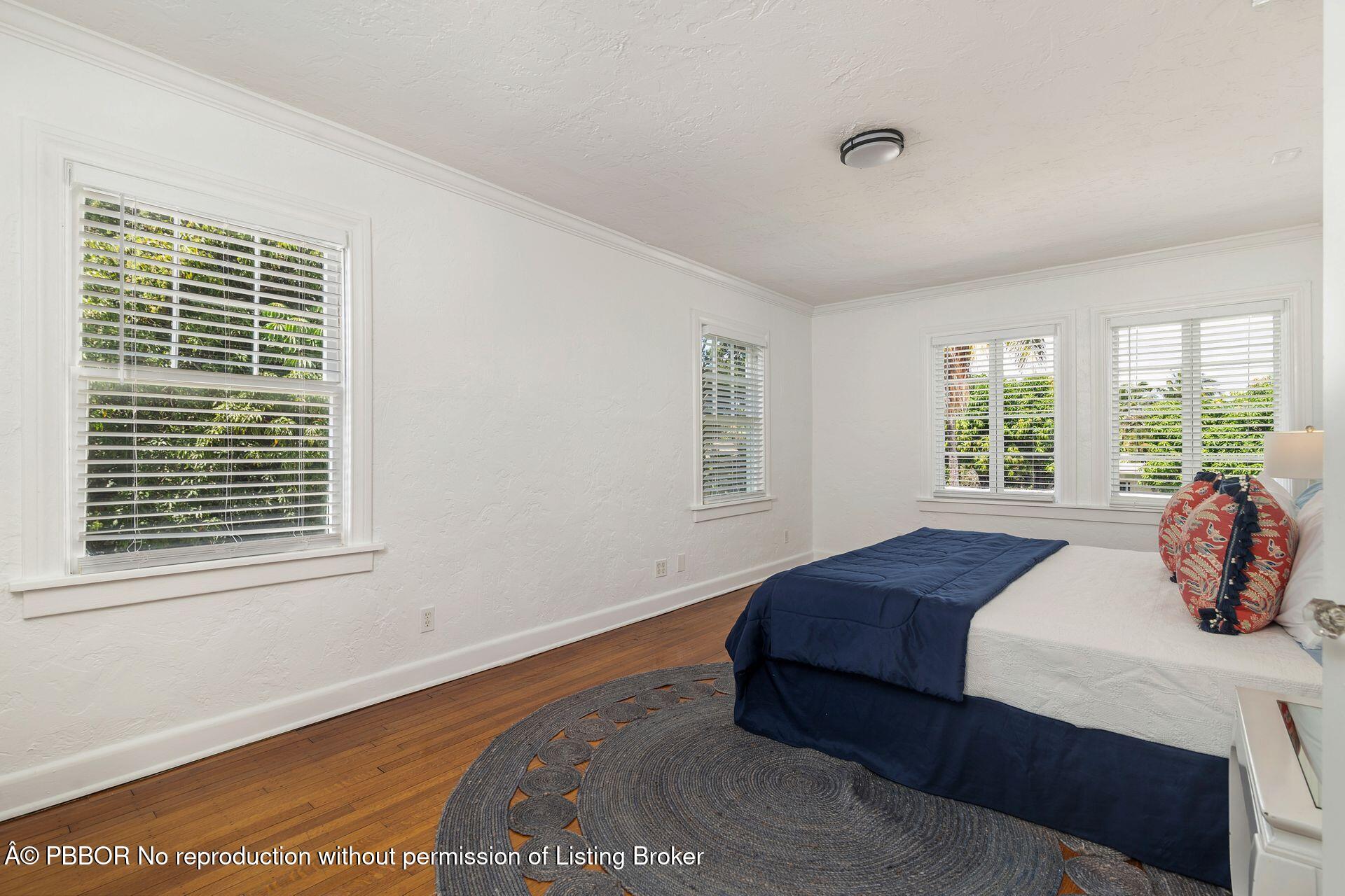 3020 Vincent Road West Palm Beach, FL 33405 - Photo 14 of 56 a bedroom with a bed and a window