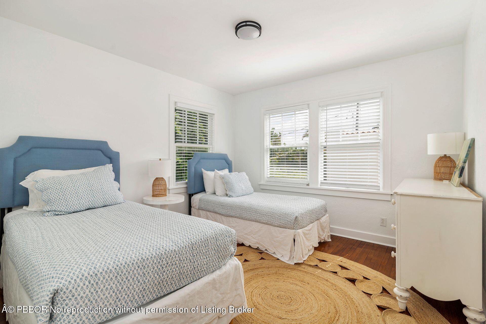 3020 Vincent Road West Palm Beach, FL 33405 - Photo 17 of 56 a bedroom with two beds and a window