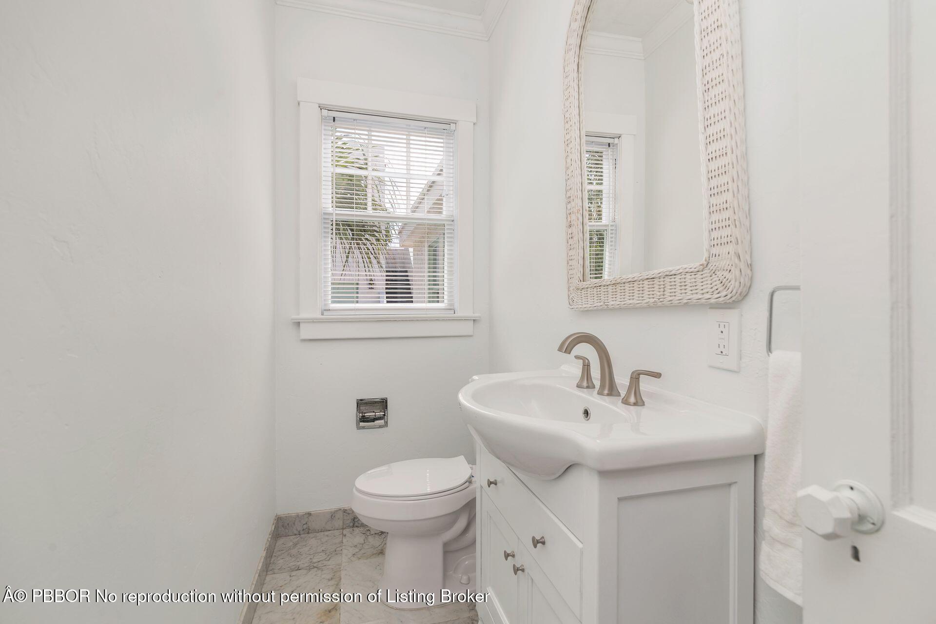 3020 Vincent Road West Palm Beach, FL 33405 - Photo 18 of 56 a bathroom with a sink and a toilet