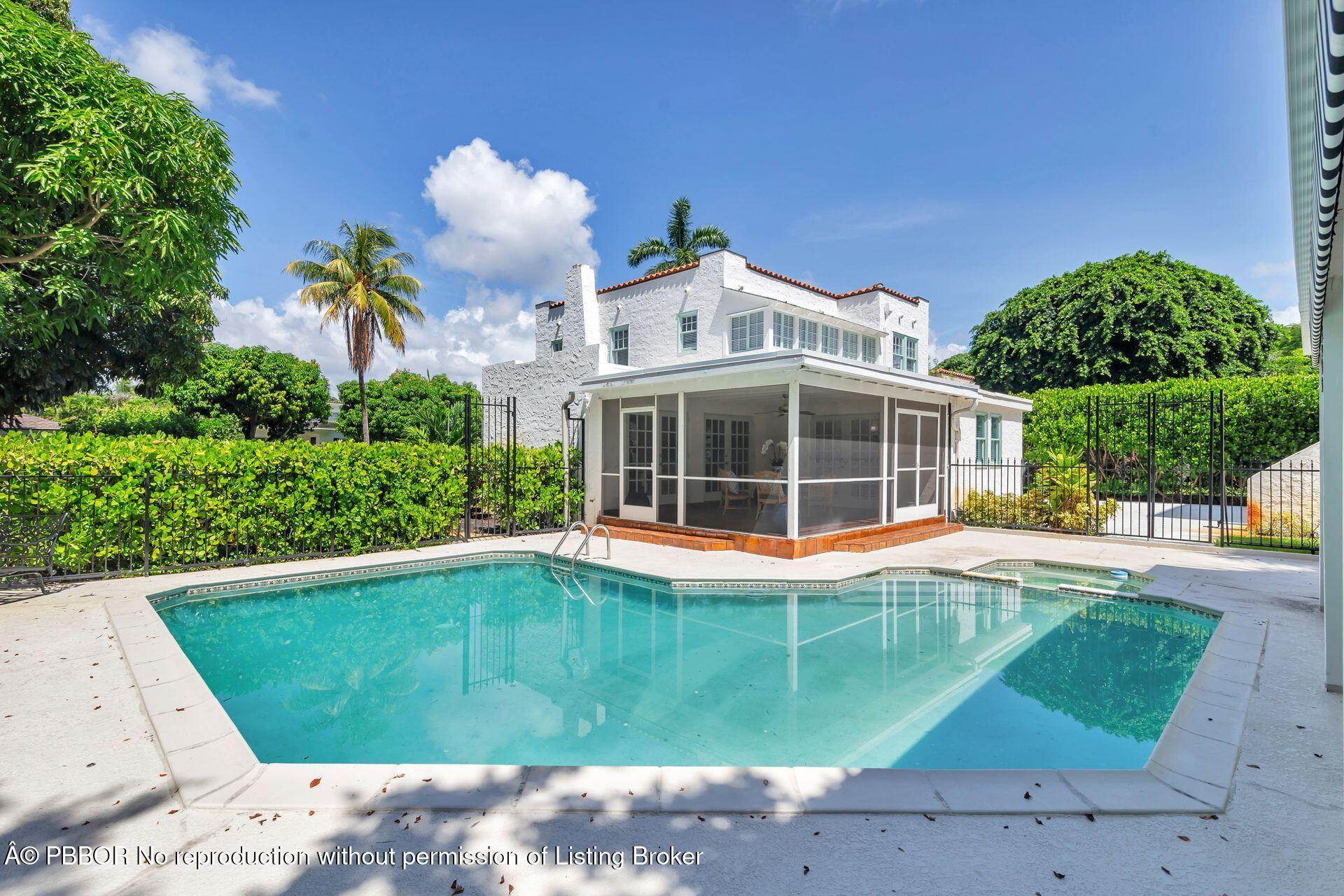 3020 Vincent Road West Palm Beach, FL 33405 - Photo 39 of 56 a front view of a house with a yard and garage