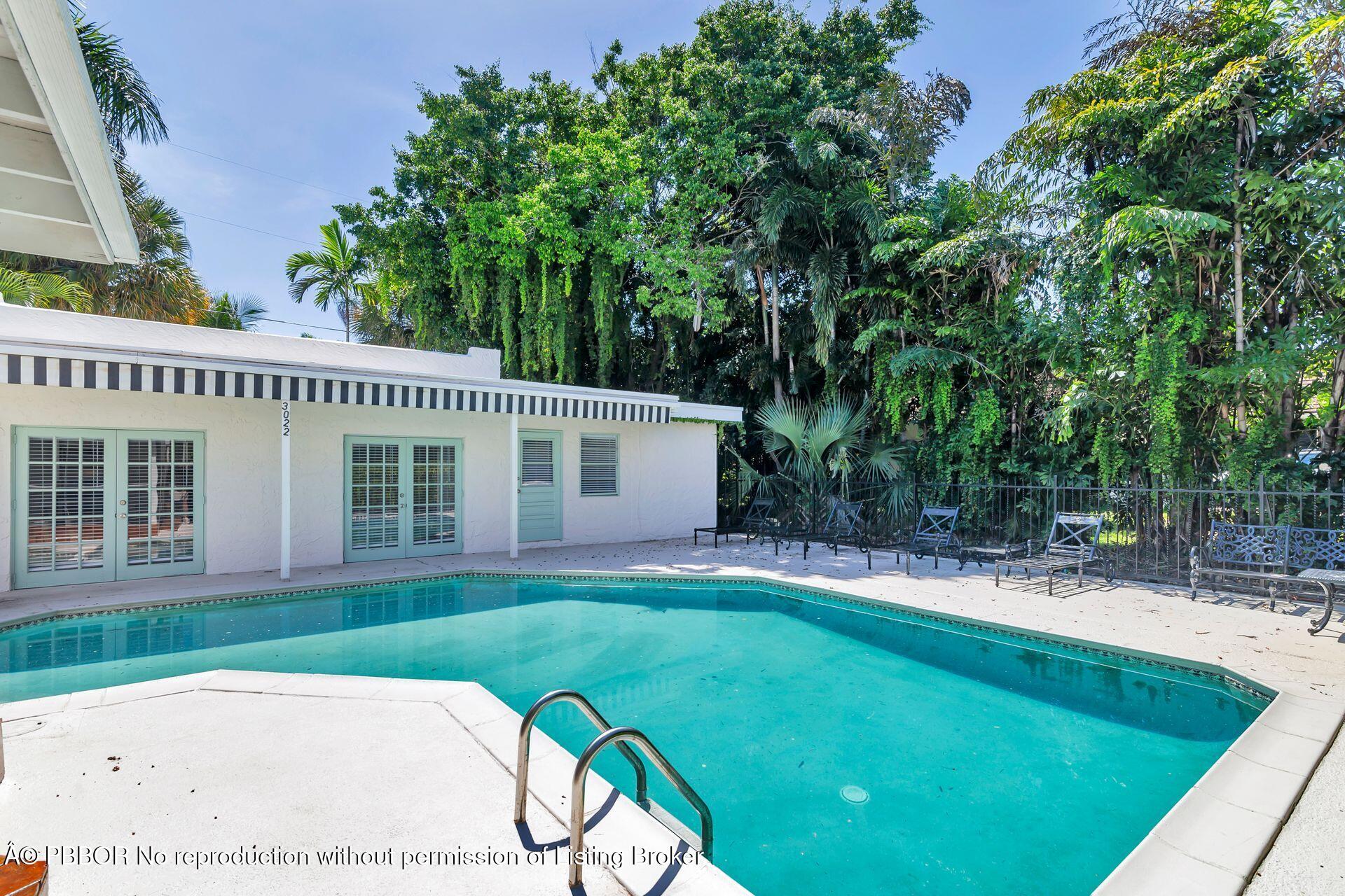 3020 Vincent Road West Palm Beach, FL 33405 - Photo 41 of 56 a view of a house with a yard