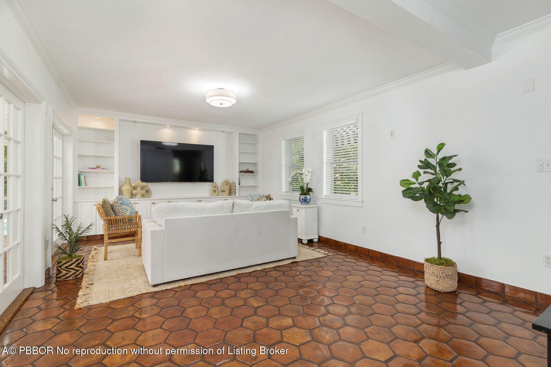 3020 Vincent Road West Palm Beach, FL 33405 - Photo 5 of 56 a living room with furniture and a flat screen tv