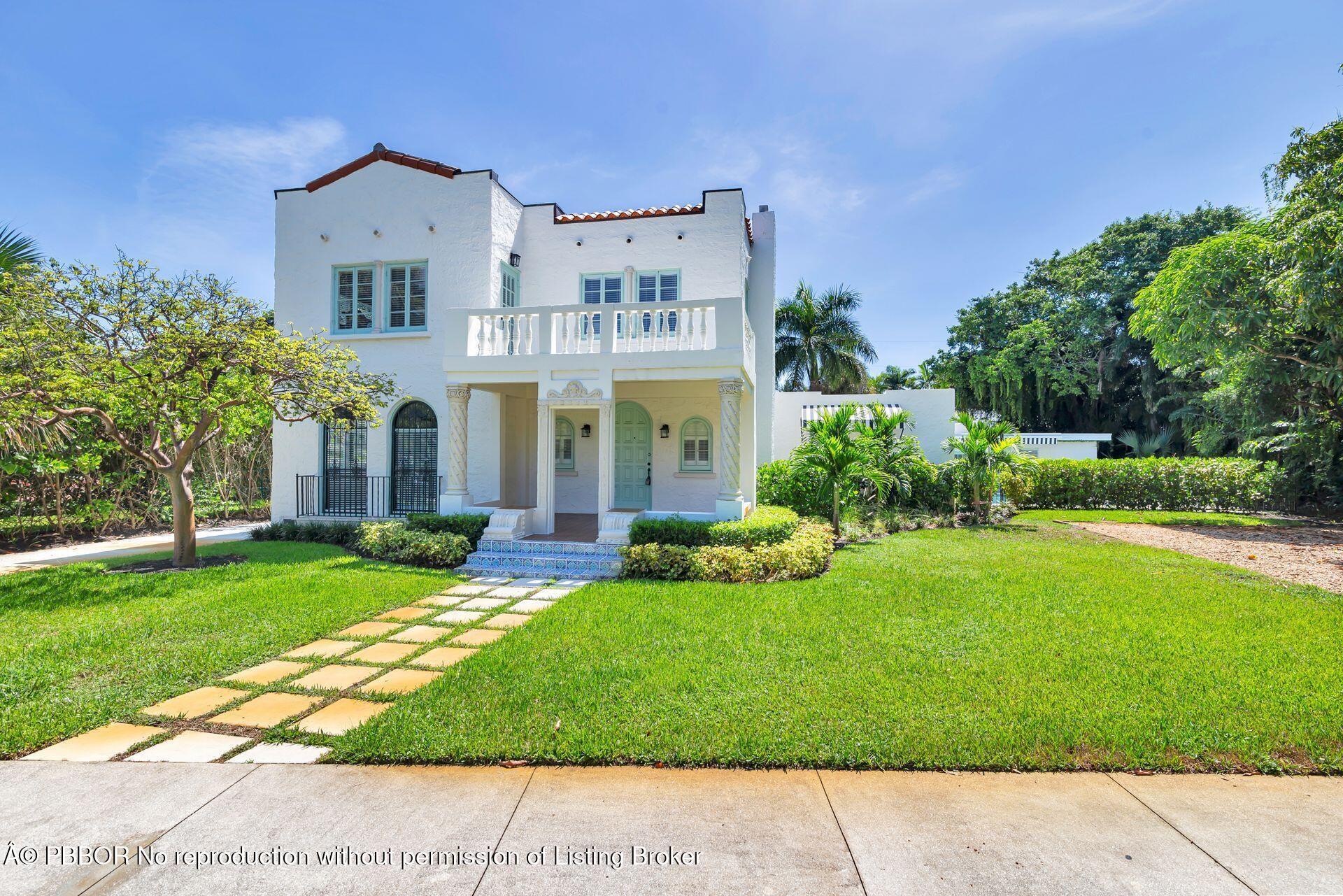 3020 Vincent Road West Palm Beach, FL 33405 - Photo 53 of 56 a front view of a house with a yard and garage