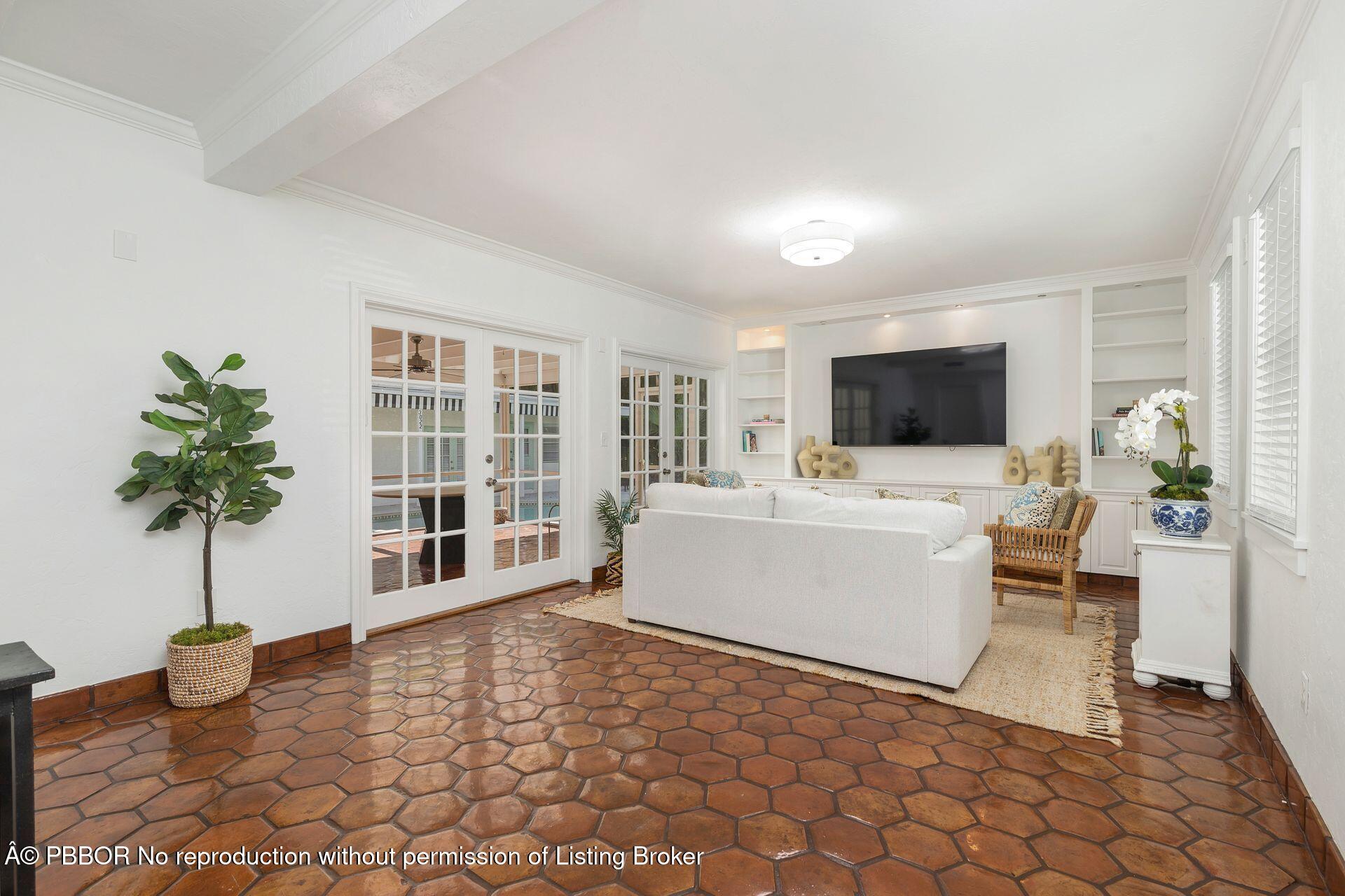 3020 Vincent Road West Palm Beach, FL 33405 - Photo 6 of 56 a living room with furniture and a flat screen tv