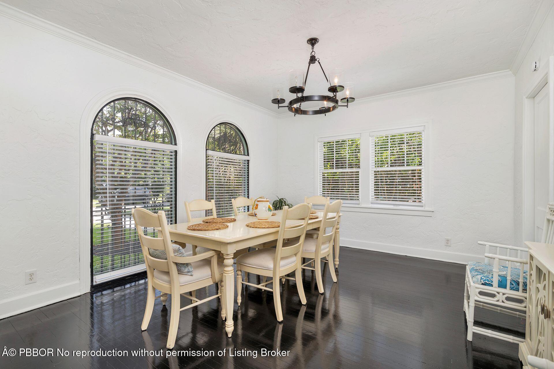 3020 Vincent Road West Palm Beach, FL 33405 - Photo 8 of 56 a view of a dining room with furniture window and wooden floor