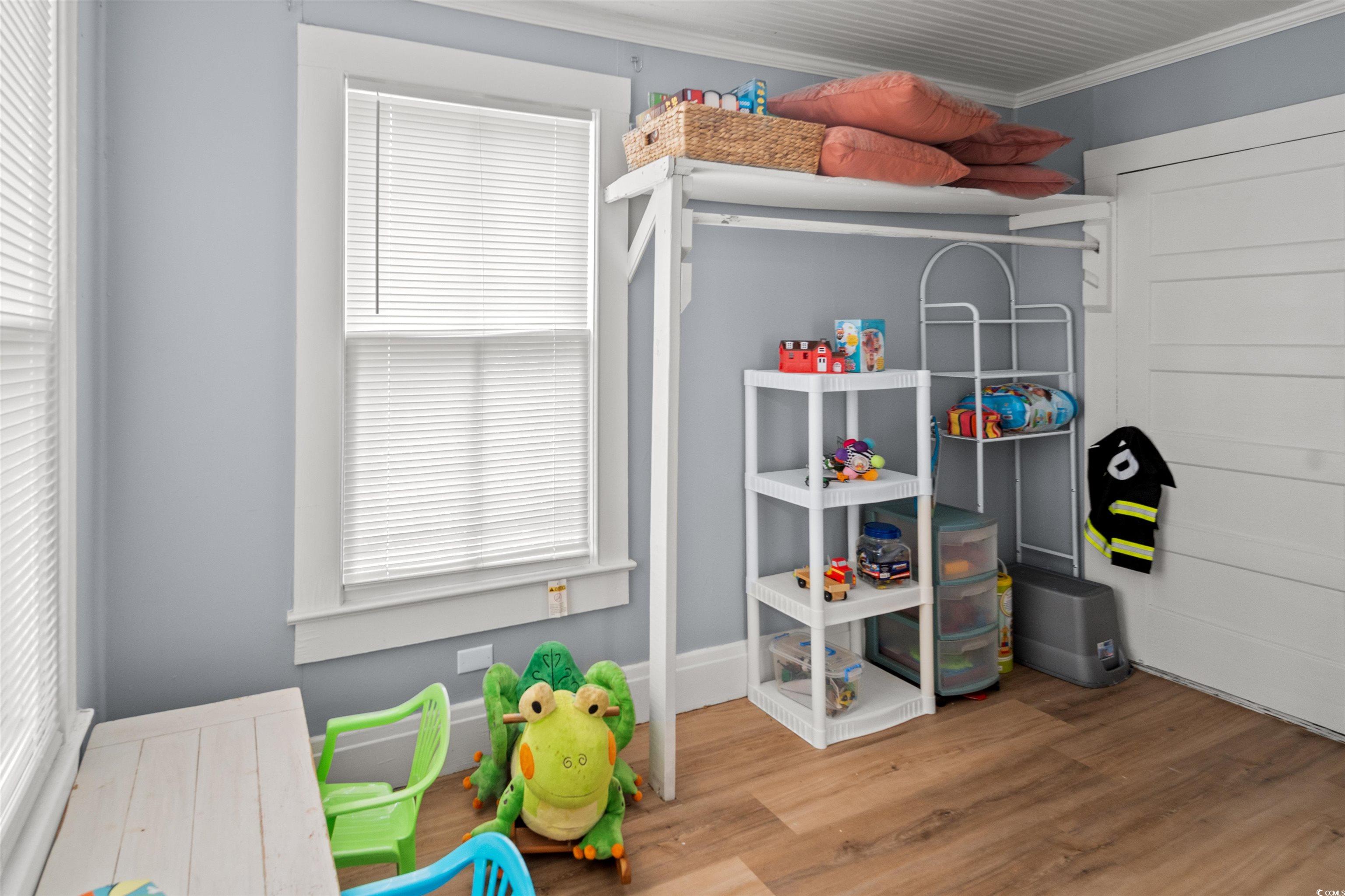 222 East Wine Street Mullins, SC 29574 - Photo 28 of 40 Bedroom featuring wood finished floors and crown molding